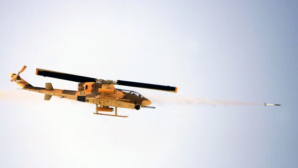 Iranian military helicopter fires a rocket during training maneuvers (File) - Sputnik International