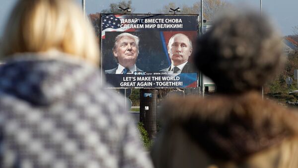 A billboard showing a pictures of US president-elect Donald Trump and Russian President Vladimir Putin is seen through pedesterians in Danilovgrad, Montenegro, November 16, 2016 - Sputnik International