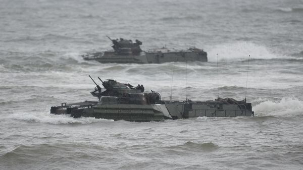 US marines Amphibious Assault vehicles (AAV) manoeuver on rough seas during a beach landing, as part of the Philippines-US amphibious landing exercise (PHIBLEX) at a naval training base facing South China sea in San Antonio town, Zambales province, north of Manila on October 7, 2016 - Sputnik International
