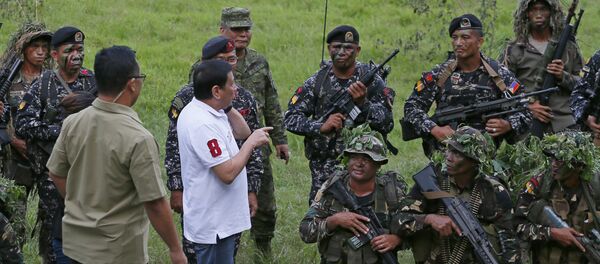 Philippine President Rodrigo Duterte talks to the Philippine Army Scout Rangers at their headquarters at Camp Tecson in San Miguel township, north of Manila,Sept. 15, 2016 Philippine President Rodrigo Duterte talks to the Philippine Army Scout Rangers at their headquarters at Camp Tecson in San Miguel township, north of Manila,Sept. 15, 2016 - Sputnik International
