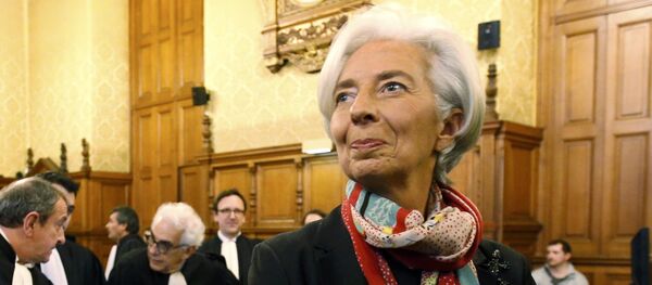 Managing Director of the International Monetary Fund (IMF) Christine Lagarde reacts before the start of her trial about a state payout in 2008 to a French businessman, at the courts in Paris, France, December 12, 2016 - Sputnik International