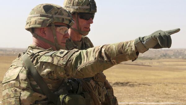 This Oct. 10, 2016 photo released by the U.S. Army shows U.S. Army Lt. Col. Ed Matthaidess, commander, left, Task Force Falcon, outlining areas of an Iraqi security forces tactical assembly area to U.S. Army Maj. Gen. Gary J. Volesky, commander, Combined Joint Forces Land Component Command – Operation Inherent Resolve, in northern Iraq - Sputnik International