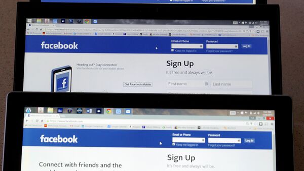 Computer screens display the Facebook sign-in screen in this photo illustration taken in Golden, Colorado, United States July 28, 2015 - Sputnik International
