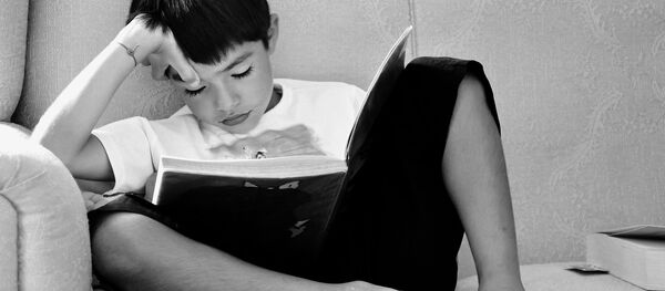 A child reading a book A child reading a book - Sputnik International