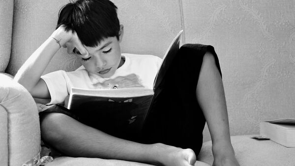 A child reading a book - Sputnik International