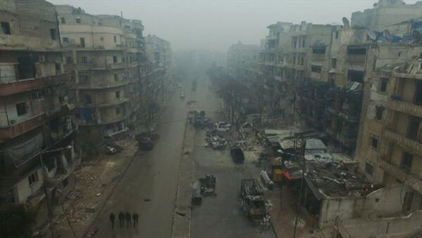 A still image from video taken December 13, 2016 of a general view of bomb damaged eastern Aleppo, Syria in the rain. Video released December 13, 2016. - Sputnik International