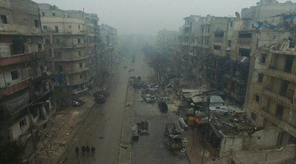 A still image from video taken December 13, 2016 of a general view of bomb damaged eastern Aleppo, Syria in the rain. Video released December 13, 2016. - Sputnik International