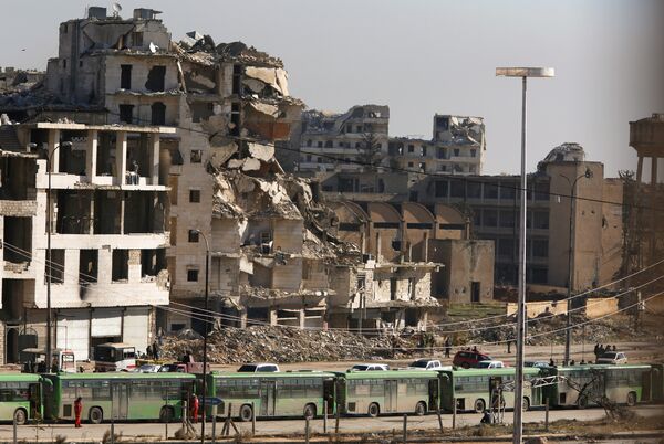 Buses are seen parked in Aleppo's government controlled area of Ramouseh, as they wait to evacuate civilians and rebels from eastern Aleppo, Syria December 15, 2016 Buses are seen parked in Aleppo's government controlled area of Ramouseh, as they wait to evacuate civilians and rebels from eastern Aleppo, Syria December 15, 2016 - Sputnik International
