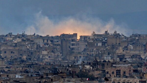 A general view shows smoke and flames rising from buildings in Aleppo's southeastern al-Zabdiya neighbourhood following government strikes on December 14, 2016. - Sputnik International