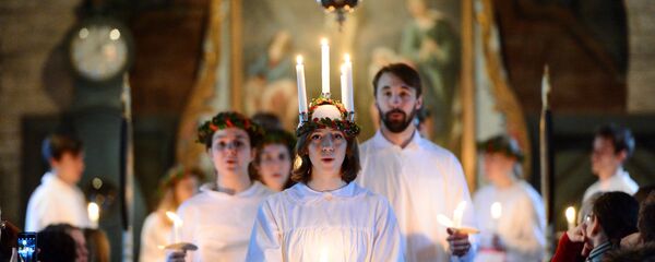 The 'Kongl. Teknologkoren' choir performs in Seglora church at the open-air museum Skansen on Saint Lucy's Day in Stockholm, Sweden, 13 December 2016. The 'Kongl. Teknologkoren' choir performs in Seglora church at the open-air museum Skansen on Saint Lucy's Day in Stockholm, Sweden, 13 December 2016. - Sputnik International