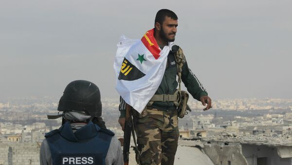 Picture of Syrian Arab Army soldier on rooftop of Sheikh Saeed in Eastern Aleppo the morning after full liberation from Nusra Front led militant factions. - Sputnik International