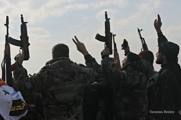 Syrian Arab Army soldiers celebrating liberation of Sheikh Saeed, East Aleppo,  from Nusra Front led occupation.  - Sputnik International