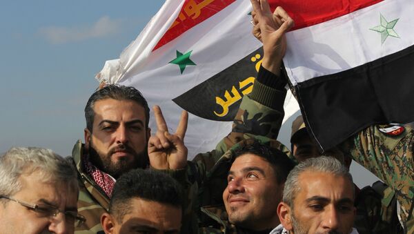 Syrian Arab Army celebrating victory in Sheikh Saeed, East Aleppo. - Sputnik International