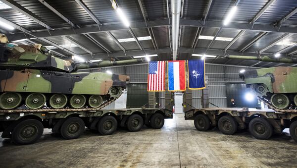 Military armoured vehicles are displayed during the inauguration of the Army Prepositioned Stocks of Eygelshoven (APS-E), a military complex for American equipment in Eygelshoven, on December 15, 2016. - Sputnik International