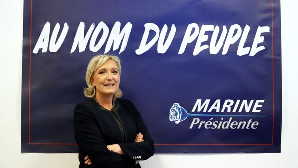 France's far-right National Front (FN) leader Marine Le Pen poses in front of a poster for her 2017 French presidential election campaign as she inaugurates her party campaign headquarters L'Escale in Paris, France, November 16, 2016. - Sputnik International