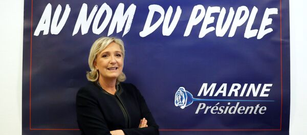 France's far-right National Front (FN) leader Marine Le Pen poses in front of a poster for her 2017 French presidential election campaign as she inaugurates her party campaign headquarters L'Escale in Paris, France, November 16, 2016. France's far-right National Front (FN) leader Marine Le Pen poses in front of a poster for her 2017 French presidential election campaign as she inaugurates her party campaign headquarters L'Escale in Paris, France, November 16, 2016. - Sputnik International