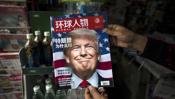 Copy of the local Chinese magazine Global People with a cover story that translates to Why did Trump win at a news stand in Shanghai. (File) - Sputnik International