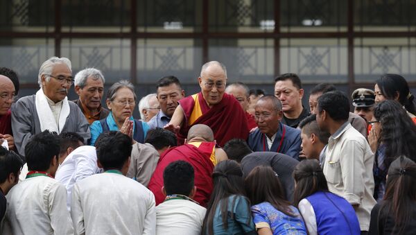 Devotees greet Tibetan spiritual leader, the Dalai Lama, center, during an event to inaugurate the Dalai Lama Institute for Higher Education, on the outskirts of Bangalore, India, Wednesday, Dec.14, 2016. - Sputnik International