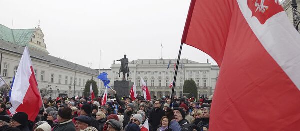 Protesters attend an anti-government demonstration, in Warsaw, Poland - Sputnik International