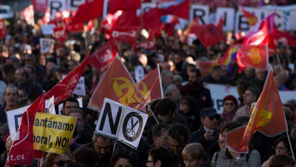 People march during a protest called by the main union against the government's austerity and social measures in Madrid, Spain December 18, 2016 - Sputnik International