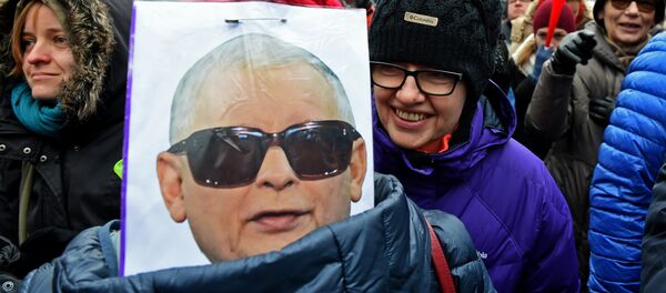 A caricature depicting Jaroslaw Kaczynski, head of leading PIS party as General Wojciech Jaruzelski, who imposed the martial law in Poland in 1981 is seen during an anti-government protest in front of the Constitutional Court to thank the outgoing head of court Andrzej Rzeplinski for his efforts to defend its independence, in Warsaw on December 18, 2016 A caricature depicting Jaroslaw Kaczynski, head of leading PIS party as General Wojciech Jaruzelski, who imposed the martial law in Poland in 1981 is seen during an anti-government protest in front of the Constitutional Court to thank the outgoing head of court Andrzej Rzeplinski for his efforts to defend its independence, in Warsaw on December 18, 2016 - Sputnik International
