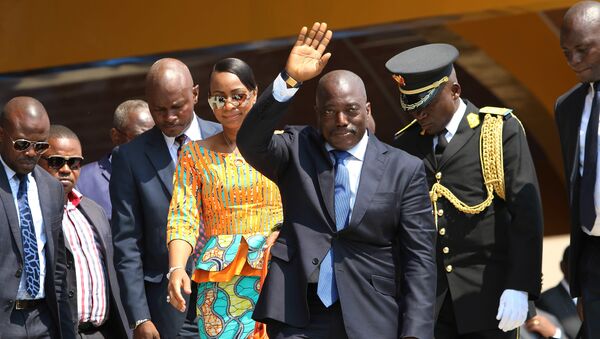 Congolese President Joseph Kabila, center, waves as he and others celebrate the Democratic Republic of Congo, DRC, independence in Kindu, Congo, Thursday, June 30, 2016. Congo's president says nothing can stop long-awaited elections from taking place even as fears mount of a possible delay. - Sputnik International