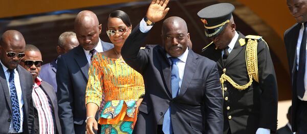 Congolese President Joseph Kabila, center, waves as he and others celebrate the Democratic Republic of Congo, DRC, independence in Kindu, Congo, Thursday, June 30, 2016. Congo's president says nothing can stop long-awaited elections from taking place even as fears mount of a possible delay. Congolese President Joseph Kabila, center, waves as he and others celebrate the Democratic Republic of Congo, DRC, independence in Kindu, Congo, Thursday, June 30, 2016. Congo's president says nothing can stop long-awaited elections from taking place even as fears mount of a possible delay. - Sputnik International
