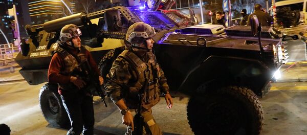 Turkish police secure the area near an art gallery where the Russian Ambassador to Turkey Andrei Karlov was shot in Ankara, Turkey, December 19, 2016 - Sputnik International