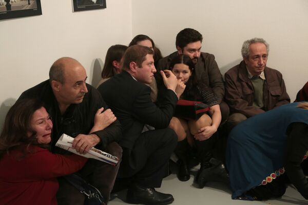 People react after the the Russian Ambassador to Turkey, Andrei Karlov, was shot at a photo gallery in Ankara, Turkey, Monday, Dec. 19, 2016 People react after the the Russian Ambassador to Turkey, Andrei Karlov, was shot at a photo gallery in Ankara, Turkey, Monday, Dec. 19, 2016 - Sputnik International