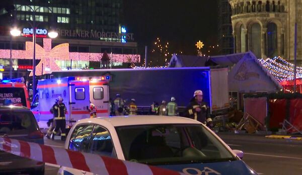 Emergency services attend the scene, after an attack by a truck at a Christmas market, in Berlin. Emergency services attend the scene, after an attack by a truck at a Christmas market, in Berlin. - Sputnik International