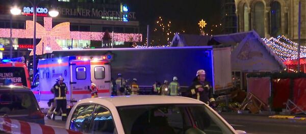Emergency services attend the scene, after an attack by a truck at a Christmas market, in Berlin. Emergency services attend the scene, after an attack by a truck at a Christmas market, in Berlin. - Sputnik International