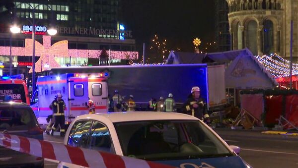Emergency services attend the scene, after an attack by a truck at a Christmas market, in Berlin. - Sputnik International