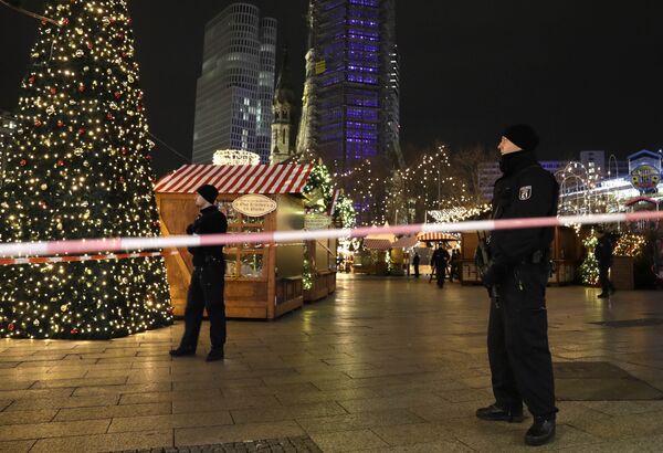Police guard a Christmas market after a truck ran into the crowded Christmas market in Berlin, Germany. Police guard a Christmas market after a truck ran into the crowded Christmas market in Berlin, Germany. - Sputnik International