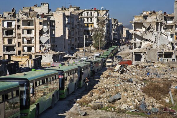 Buses are seen during an evacuation operation of rebel fighters and their families from rebel-held neighbourhoods in the embattled city of Aleppo on December 15, 2016 Buses are seen during an evacuation operation of rebel fighters and their families from rebel-held neighbourhoods in the embattled city of Aleppo on December 15, 2016 - Sputnik International
