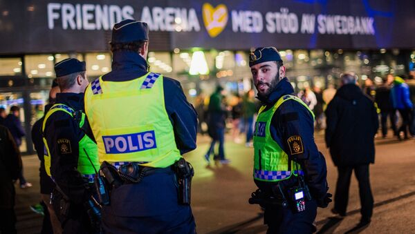 Police officers are pictured ahead of the Euro 2016 play-off football match between Sweden and Denmark at the Friends arena in Solna on November 14, 2015 - Sputnik International