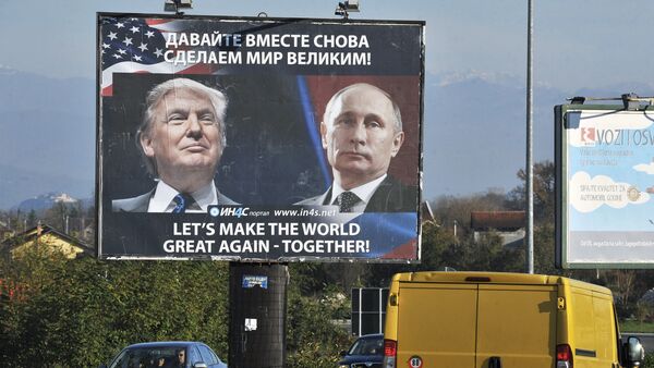 Cars pass by a billboard showing US President-elect Donald Trump and Russian President Vladimir Putin placed by pro-Serbian movement in the town of Danilovgrad on November 16, 2016 - Sputnik International