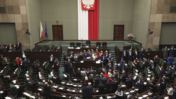 Polish opposition parliamentarians protest against the rules proposed by the head office of the Sejm, the lower house of parliament, ban all recording of parliamentary sessions except by five selected television stations and limits the number of journalists allowed in the building, in the Parliament in Warsaw, Poland December 16, 2016 - Sputnik International