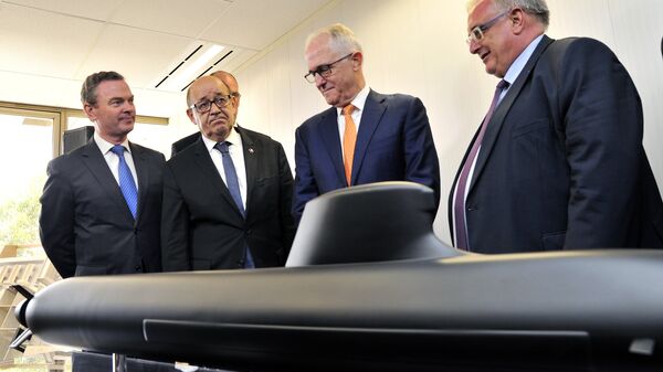 Australian Prime Minister Malcolm Turnbull, second right, stands with French Defense Minister Jean-Yves Le Drian, second left, Australian Defence Industry Minister Christopher Pyne, left, and Herve Guillou, chief executive officer of DCNS, a French state majority-owned company that will design the Shortfin Barracuda subs, as they look at a model of a submarine at the opening of the Australian headquarters of DCNS in Adelaide, Australia, Tuesday, Dec. 20, 2016 - Sputnik International
