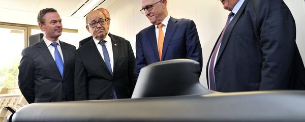 Australian Prime Minister Malcolm Turnbull, second right, stands with French Defense Minister Jean-Yves Le Drian, second left, Australian Defence Industry Minister Christopher Pyne, left, and Herve Guillou, chief executive officer of DCNS, a French state majority-owned company that will design the Shortfin Barracuda subs, as they look at a model of a submarine at the opening of the Australian headquarters of DCNS in Adelaide, Australia, Tuesday, Dec. 20, 2016 Australian Prime Minister Malcolm Turnbull, second right, stands with French Defense Minister Jean-Yves Le Drian, second left, Australian Defence Industry Minister Christopher Pyne, left, and Herve Guillou, chief executive officer of DCNS, a French state majority-owned company that will design the Shortfin Barracuda subs, as they look at a model of a submarine at the opening of the Australian headquarters of DCNS in Adelaide, Australia, Tuesday, Dec. 20, 2016 - Sputnik International