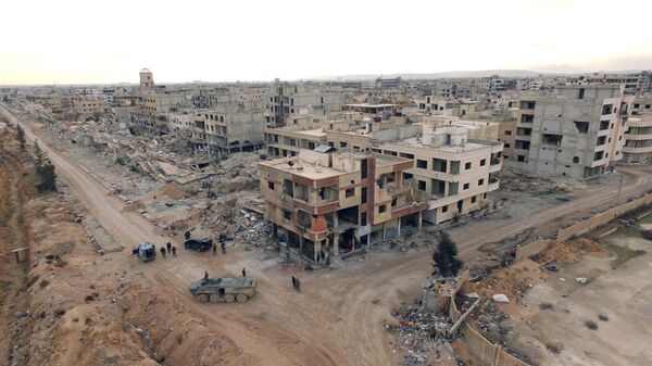 Syrian army troops move through the town of Darayya, a suburb of Damascus. Syrian army troops move through the town of Darayya, a suburb of Damascus. - Sputnik International