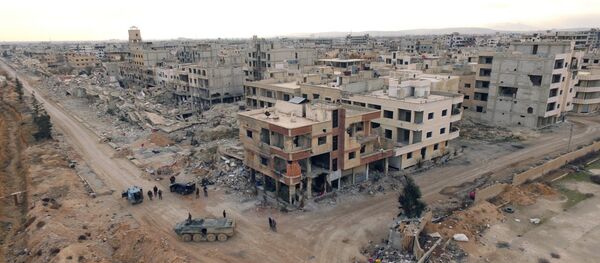 Syrian army troops move through the town of Darayya, a suburb of Damascus. Syrian army troops move through the town of Darayya, a suburb of Damascus. - Sputnik International