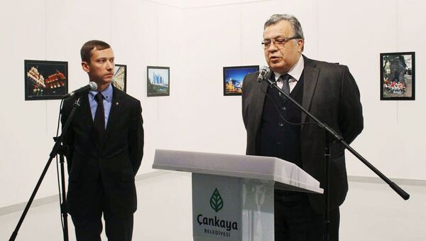Russian Ambassador Andrei Karlov (right) at the opening of a photo exhibition in the Center of Modern Art in Ankara. (The image is a hand-out material granted by a third party. Editorial use only. Archivation, commercial use or promotional campaign are banned). Photo by ANADOLU/RIA Novosti - Sputnik International