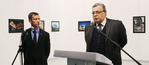 Russian Ambassador Andrei Karlov (right) at the opening of a photo exhibition in the Center of Modern Art in Ankara. (The image is a hand-out material granted by a third party. Editorial use only. Archivation, commercial use or promotional campaign are banned). Photo by ANADOLU/RIA Novosti Russian Ambassador Andrei Karlov (right) at the opening of a photo exhibition in the Center of Modern Art in Ankara. (The image is a hand-out material granted by a third party. Editorial use only. Archivation, commercial use or promotional campaign are banned). Photo by ANADOLU/RIA Novosti - Sputnik International