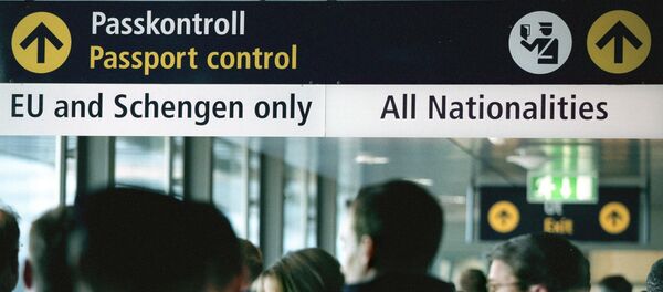 Travellers queue for passport control (File) Travellers queue for passport control (File) - Sputnik International