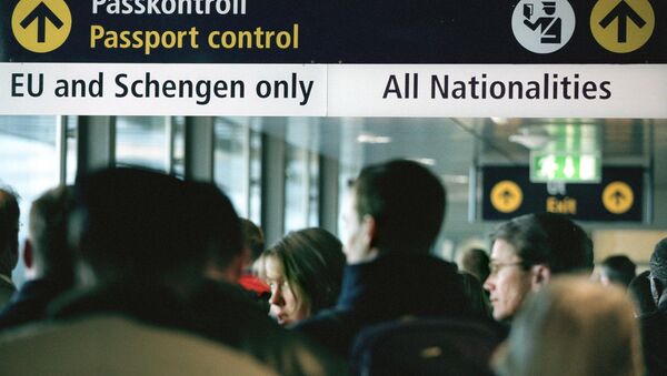 Travellers queue for passport control  (File) - Sputnik International