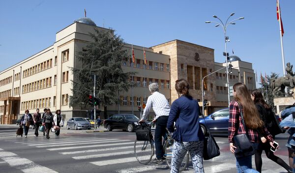 People walk across a street in front of the Parliament building in Macedonia’s capital Skopje, Thursday, April 7, 2016 People walk across a street in front of the Parliament building in Macedonia’s capital Skopje, Thursday, April 7, 2016 - Sputnik International