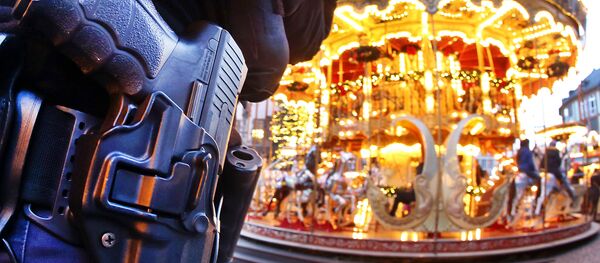 A German police officer stands next to a merry-go-round in the Christmas market in Frankfurt, Germany, Tuesday, Dec. 20, 2016 one day after a truck ran into a crowded Christmas market in Berlin killing several people A German police officer stands next to a merry-go-round in the Christmas market in Frankfurt, Germany, Tuesday, Dec. 20, 2016 one day after a truck ran into a crowded Christmas market in Berlin killing several people - Sputnik International