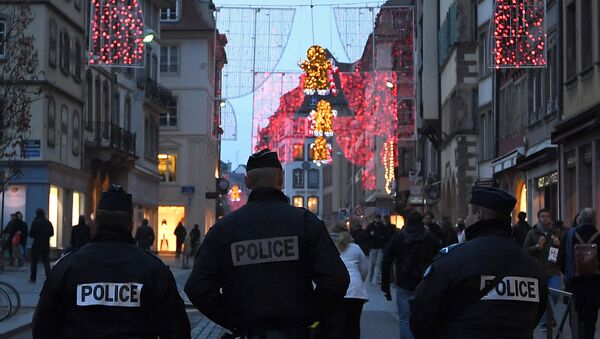 Police officers patrol at the entrance of the Christmas market in Strasbourg, eastern France - Sputnik International