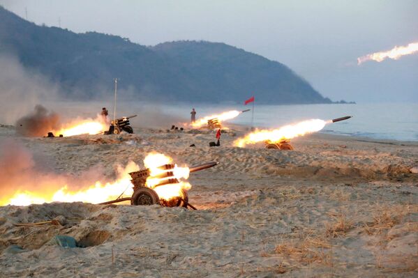 A view of a firing contest among multiple launch rocket system (MLRS) batteries selected from large combined units of the KPA, in this undated photo released by North Korea's Korean Central News Agency (KCNA) in Pyongyang - Sputnik International