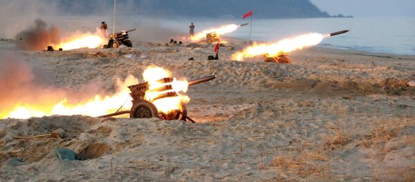 A view of a firing contest among multiple launch rocket system (MLRS) batteries selected from large combined units of the KPA, in this undated photo released by North Korea's Korean Central News Agency (KCNA) in Pyongyang - Sputnik International